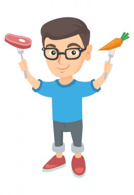 Beyaz çocuk tutarak taze havuç ve biftek.