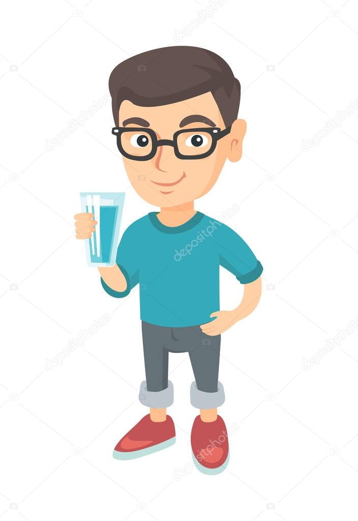 Little caucasian boy holding a glass of water.