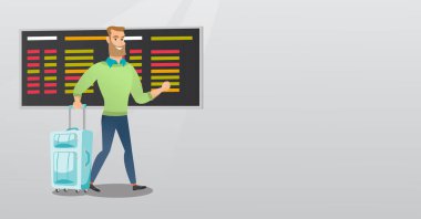 Beyaz adam havaalanında bavul ile yürüyor