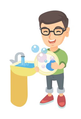 Küçük beyaz çocuk lavaboya bulaşık.