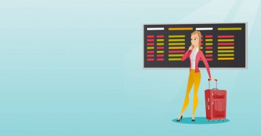 Kalkış panosu havaalanında arayan kadın.