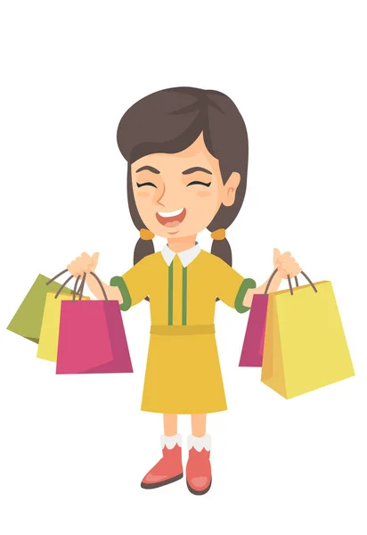 Menina caucasiana feliz segurando sacos de compras . —  Vetores de Stock
