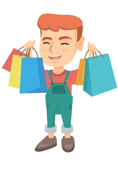 Heureux caucasien garçon tenant shopping sacs . — Image vectorielle