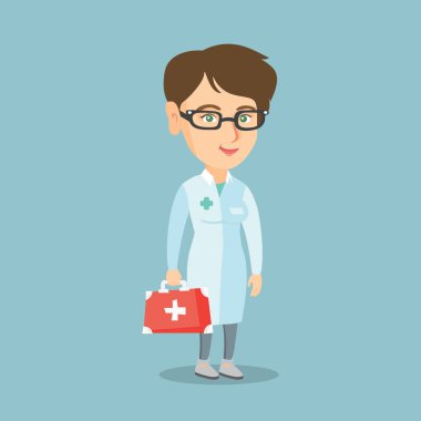 Bir ilk yardım kutusu tutan genç bir beyaz doktor.