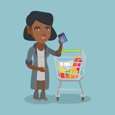 Afrikalı kadın bir hesap makinesi fiyatları kontrol.