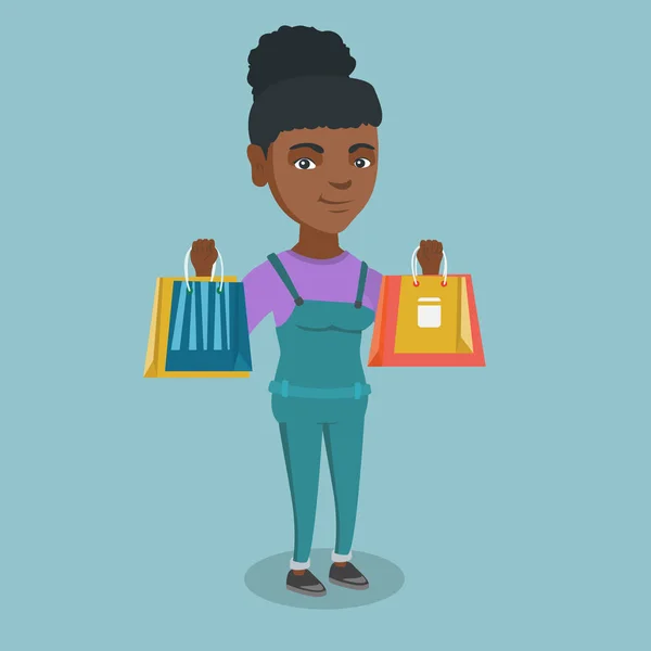 Joven mujer afroamericana sosteniendo bolsas de compras — Vector de stock