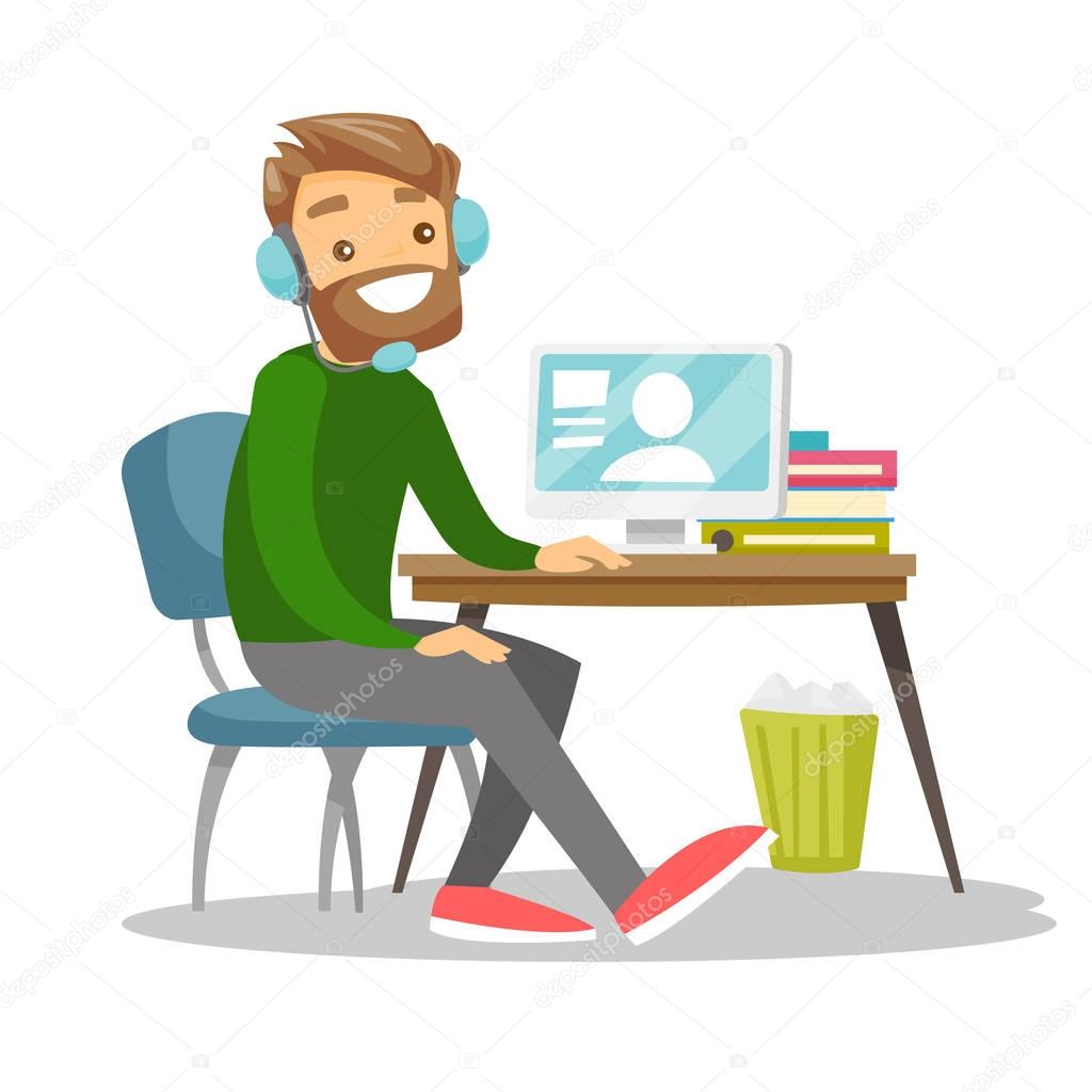 Man using headset and computer in call center.