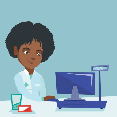 Bir eczane, bir bilgisayarda çalışan eczacı.