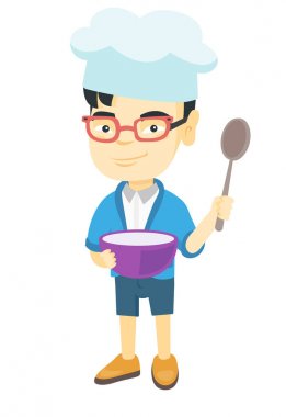 Asyalı çocuk bir tencere ve bir kaşık tutan.