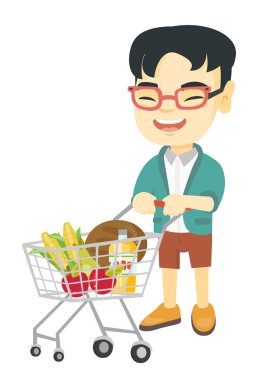 Küçük Asyalı çocuk onun alışveriş arabası ile.