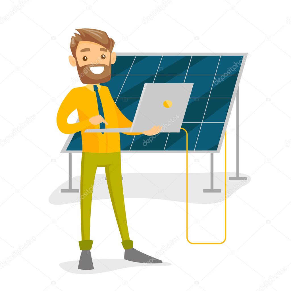 Engineer of solar power plant working on a laptop.