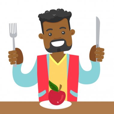 Afrikalı-Amerikalı genç bir elma yemek.