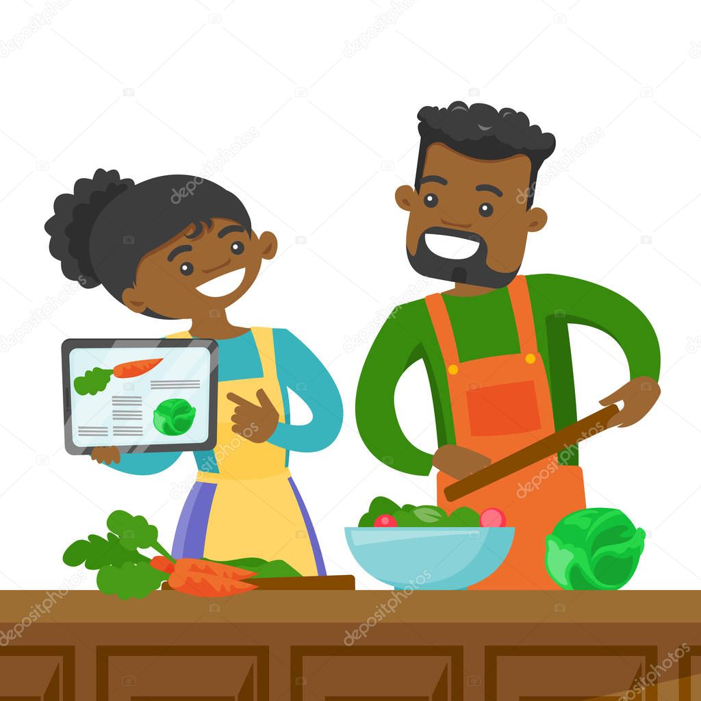 Couple looking for a recipe in a digital tablet.