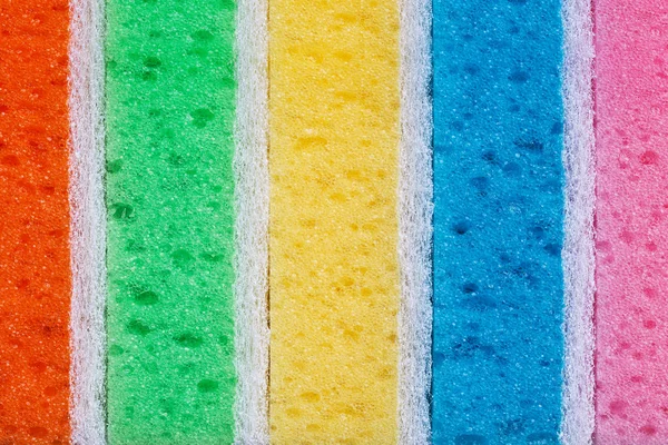 Fila de esponjas de espuma coloridas close-up . — Fotografia de Stock