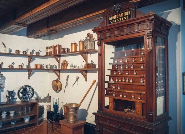 Kaunas, Lithuania - May 12, 2017: old apothecary cabinet of homeopathy drugs and shelf with retro pharmaceutical equipment in Museum of the History of Medicine and Pharmacy. Kaunas, Lithuania. — Stock Photo, Image