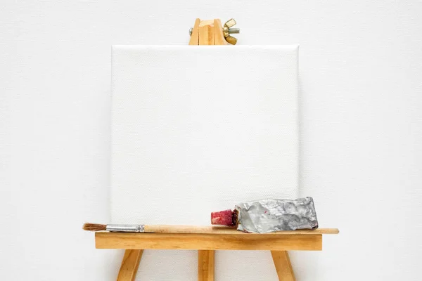 Canvas Easel Paint Tube Paintbrush White Canvas Background Top View — Stock Photo, Image