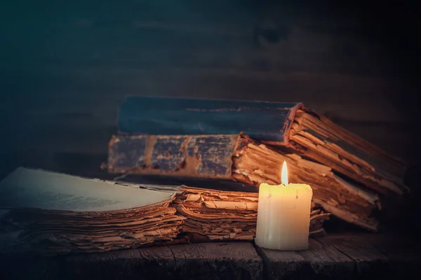 Old books and candle. — Stock Photo, Image