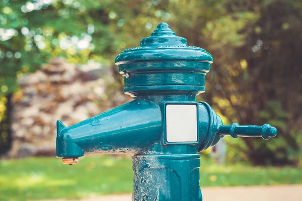 A tap with drinking water outdoors. Public water source. — Stock Photo, Image