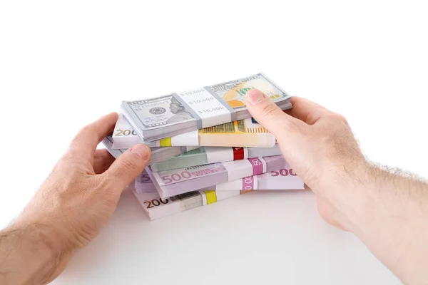 Händer med sedlar dollar och euroon vit. — Stockfoto
