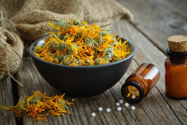 Bottles Homeopathic Calendula Granules Healthy Marigold Flowers Bowl Sack Wooden — Stock Photo, Image