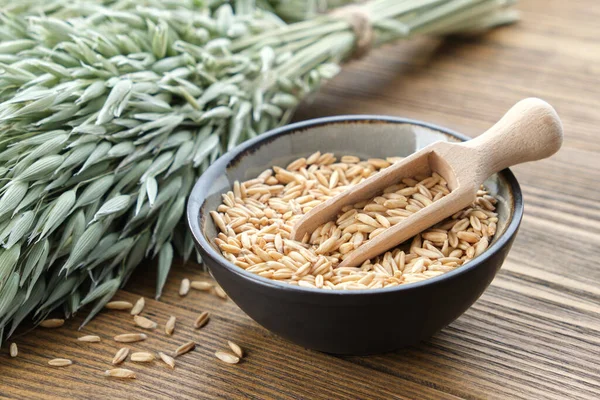 Bowl Oat Grains Green Oat Ears Wooden Table — Stock Photo, Image