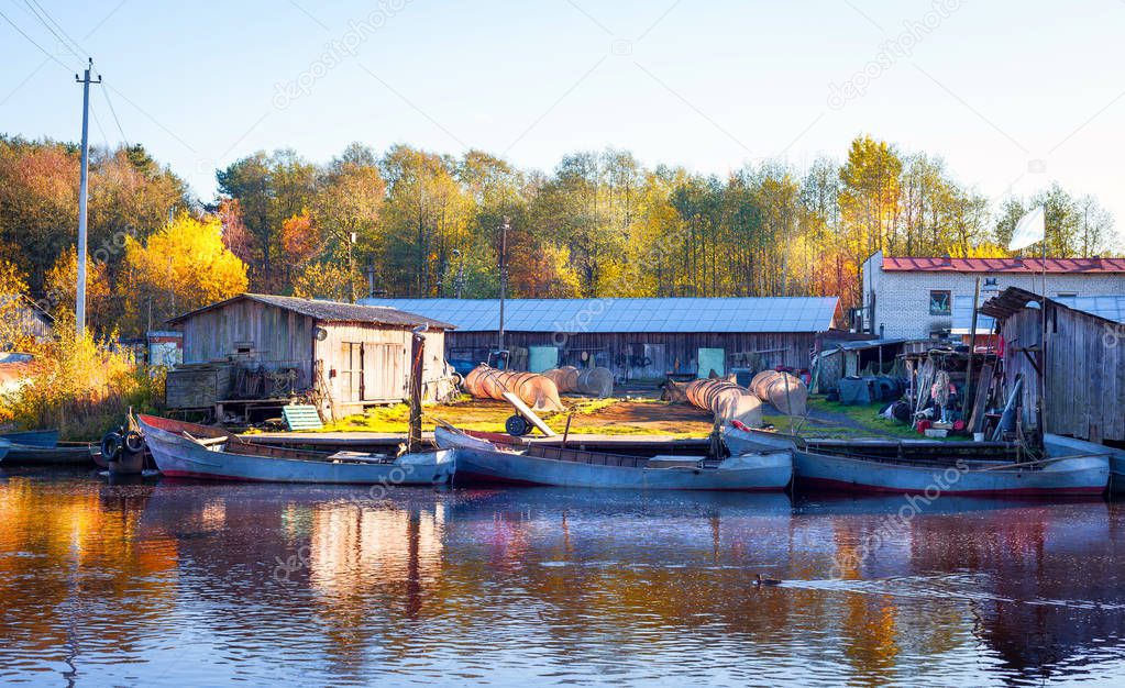 The fish farm with boats on the river