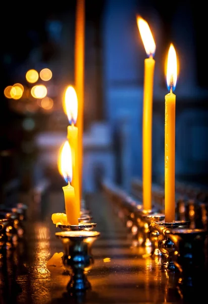A few burning candles on the altar in the Christian Church — Stock Photo, Image