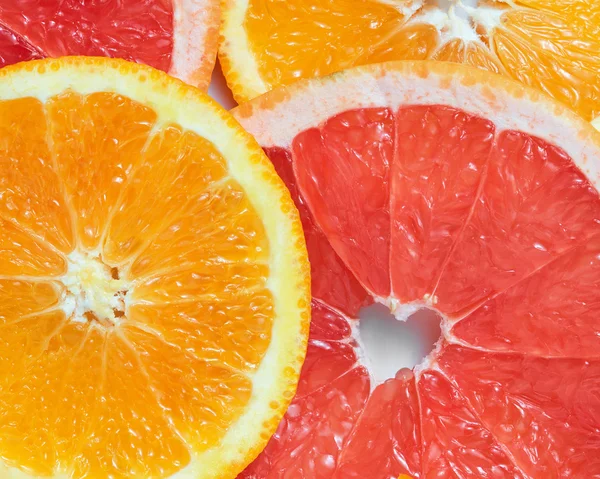 Baggrund med citrusfrugter af friske skiver - Stock-foto