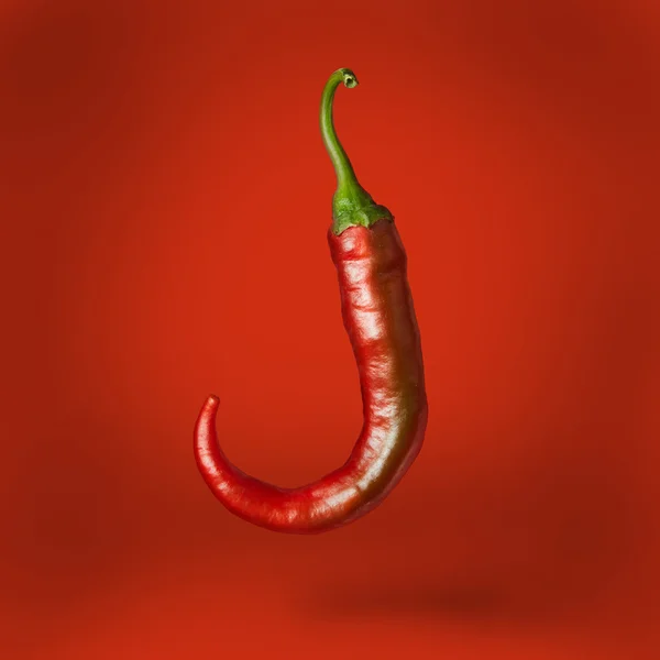 Papryka chili, unosząca się nad — Zdjęcie stockowe