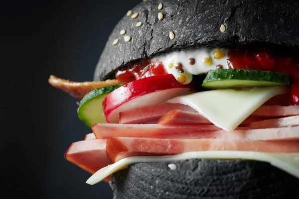 Macro Black burger — Stock Photo, Image