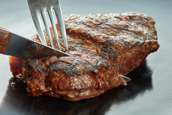 Juicy medium rare steak on plate