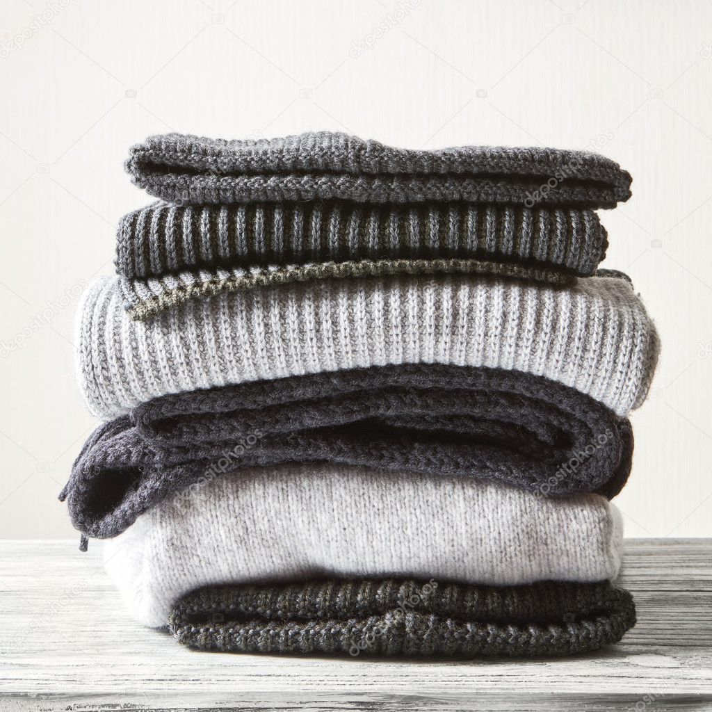 Pile of knitted winter clothes