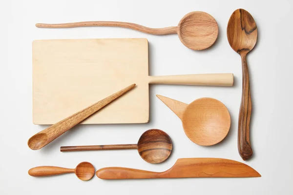 Various kitchen utensil on white wooden background — Stock Photo, Image
