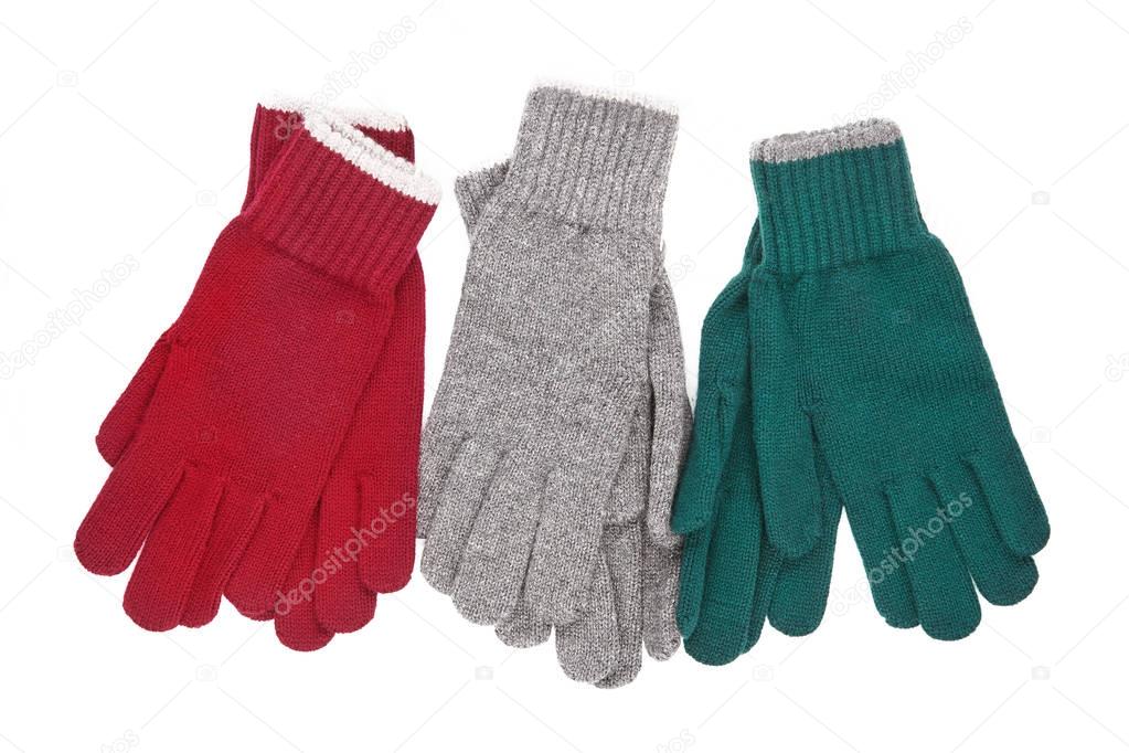 three pairs of knitted gloves