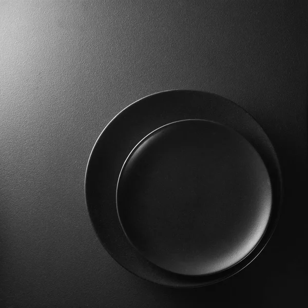 Black plates composition — Stock Photo, Image