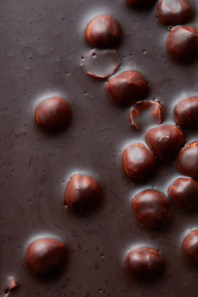 Textuur van chocolade met noten — Stockfoto