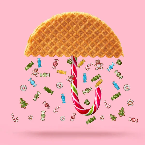 Paraplu gemaakt van wafel en snoep riet — Stockfoto