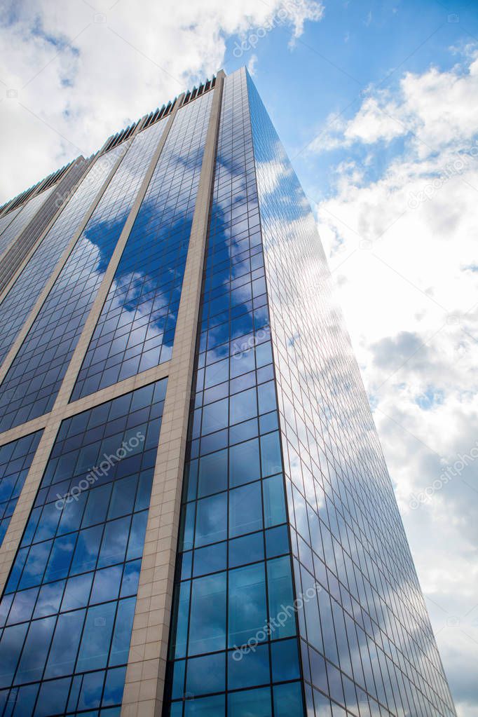 reflection of sky in modern skyscraper