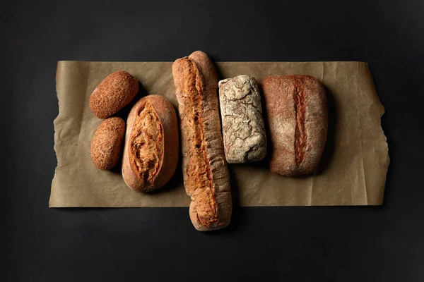 Different kinds of bread on background — Stock Photo, Image