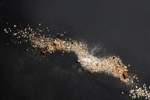 Sprinkled flour and oat flakes — Stock Photo, Image