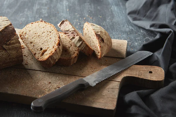 Homemade bread on cutting board — Stock Photo, Image