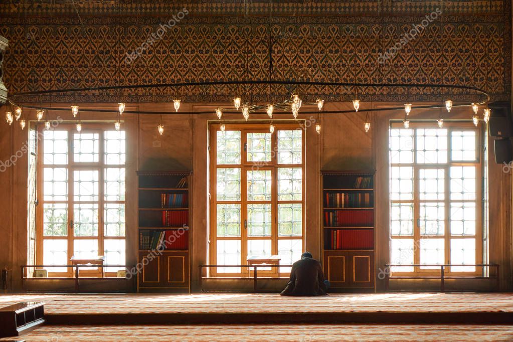 man praying in Suleymaniye mosque