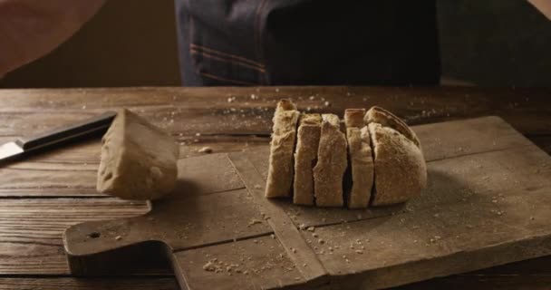 Man Throwing Sliced Fresh Bread Wooden Board Slow Motion — Stock Video