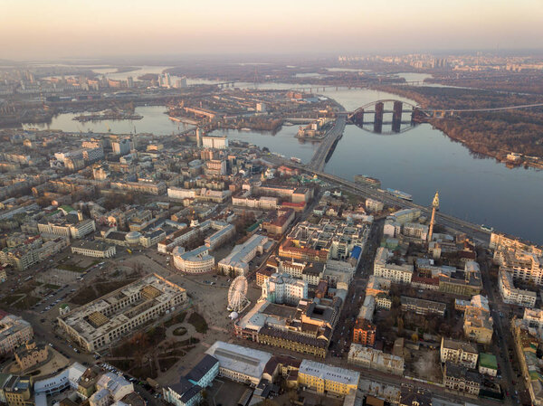 aerial view of the Kyiv city with Dnieper river, many bridges, district Obolon, Museum of History of Kiev, St. Andrew's Church and the district of Vozdvizhenka and Podol, Ukraine
