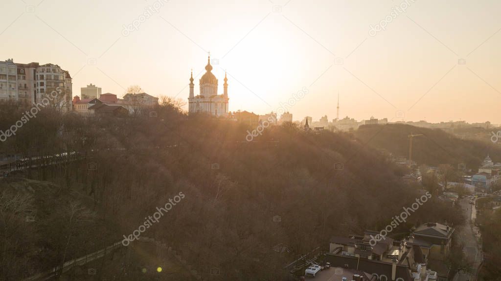 Aerial view of Saint Andrew's church and Andreevska street, cityscape of Podol district city of Kyiv , Ukraine