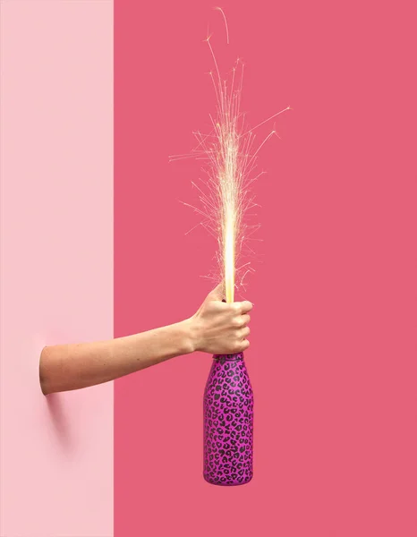 Woman Hand Holds Painted Champagne Bottle Holiday Firecracker Duotone Pink — Stock Photo, Image