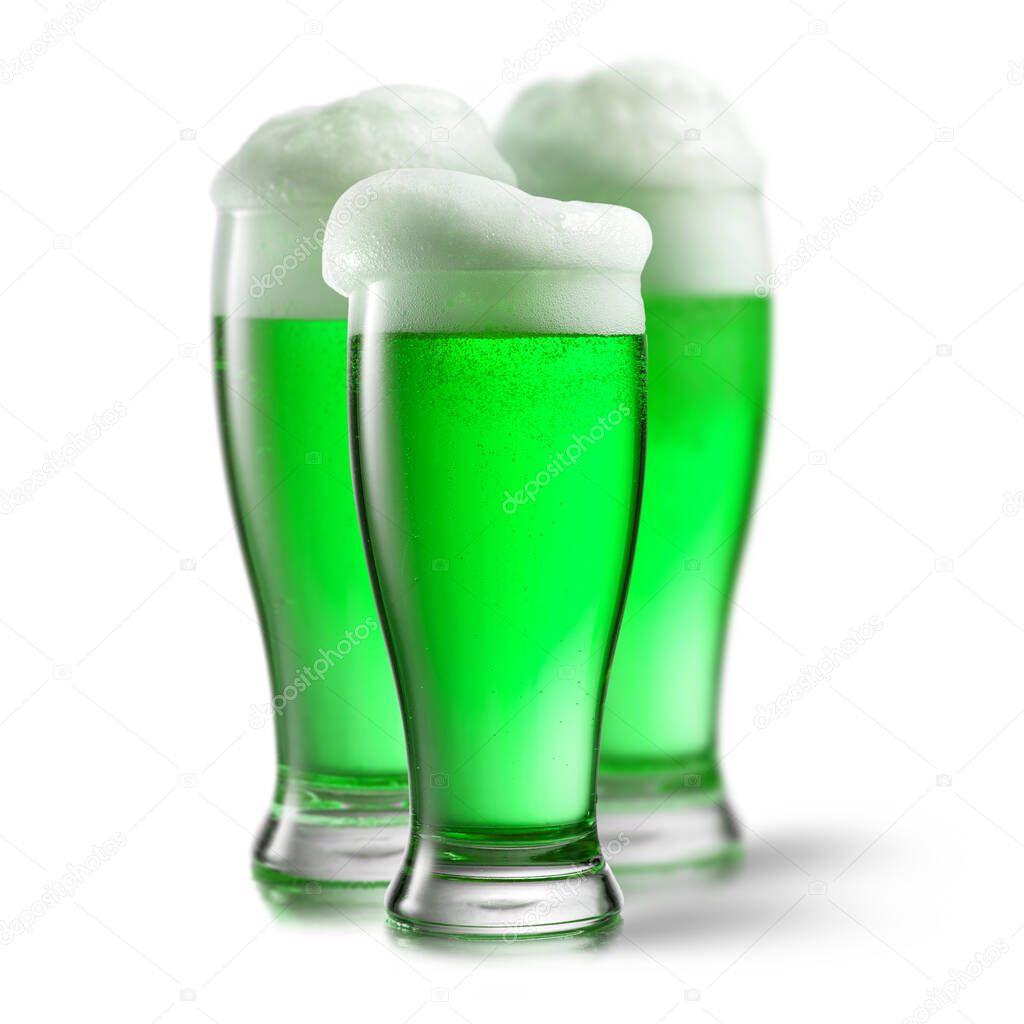 Fresh natural green alcoholic beer drink in the three glasses on a white background with soft shadows, copy space. Happy St.Patrick 's Day concept.