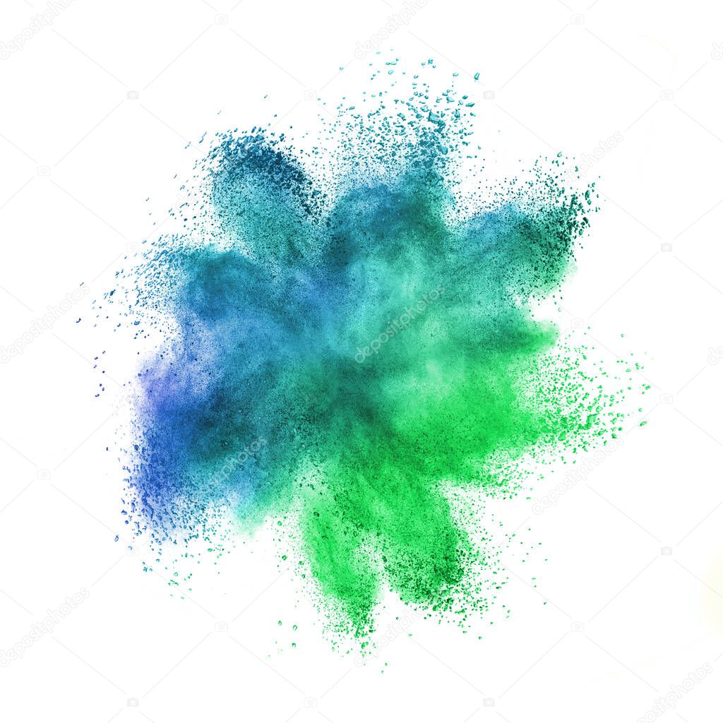 Abstract chaotic powder or dust explosion in green and blue colors on a white background with copy space.