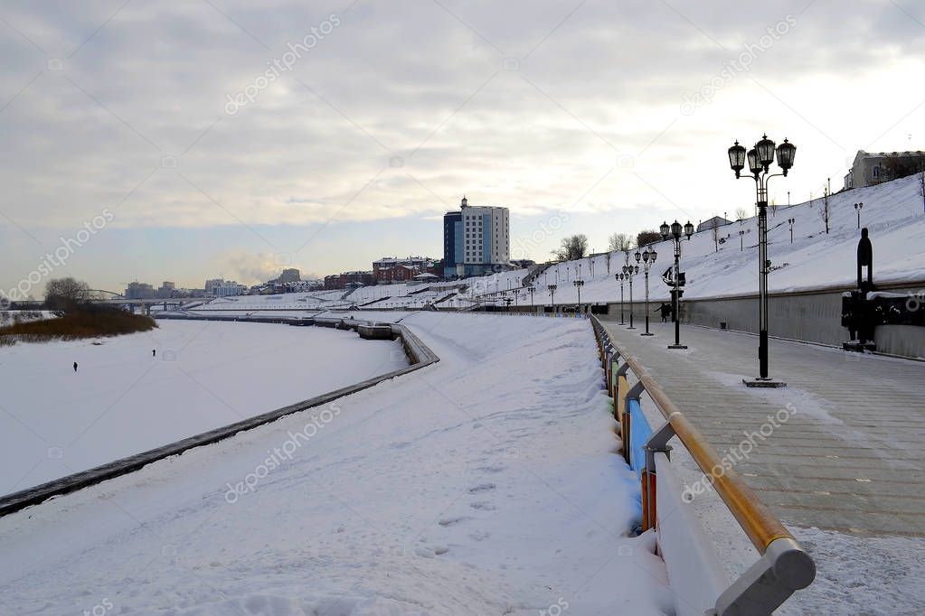 View of the Tura River and the embankment in Tyumen, Russia. Feb