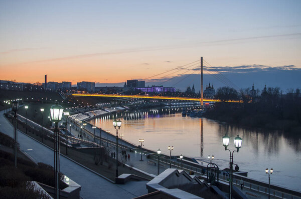 Tyumen, Russia, on April 15, 2020: A spring high water on the embankment in Tyumen in the evening.